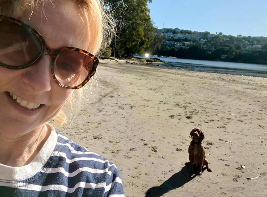 Founder of Calm Paws Relocation with dog in Australia